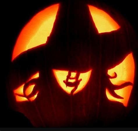 Pumpkin carved as a witch with a hat
